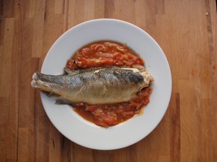 my version of fish in crazy water: sea bass above sauteed tomatoes, onions, and garlic in white wine